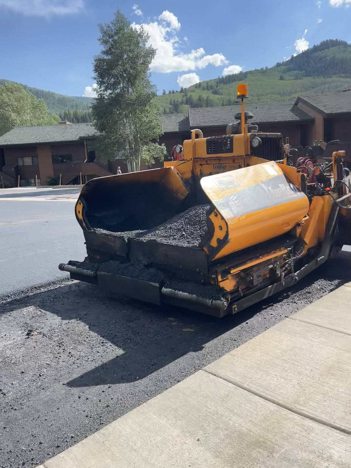 Laying hot mix at a condo complex. The paver comes in for the week.