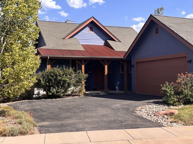 A finished asphalt driveway at a home in the Eagle River Valley