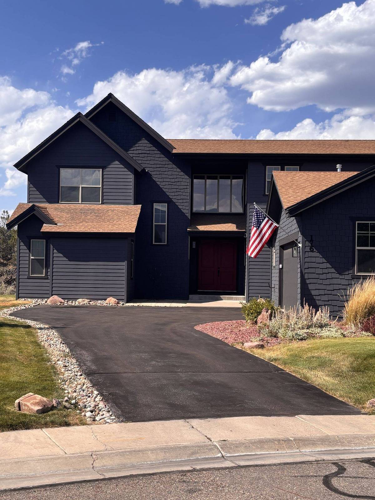 A newly replaced driveway at a two story home