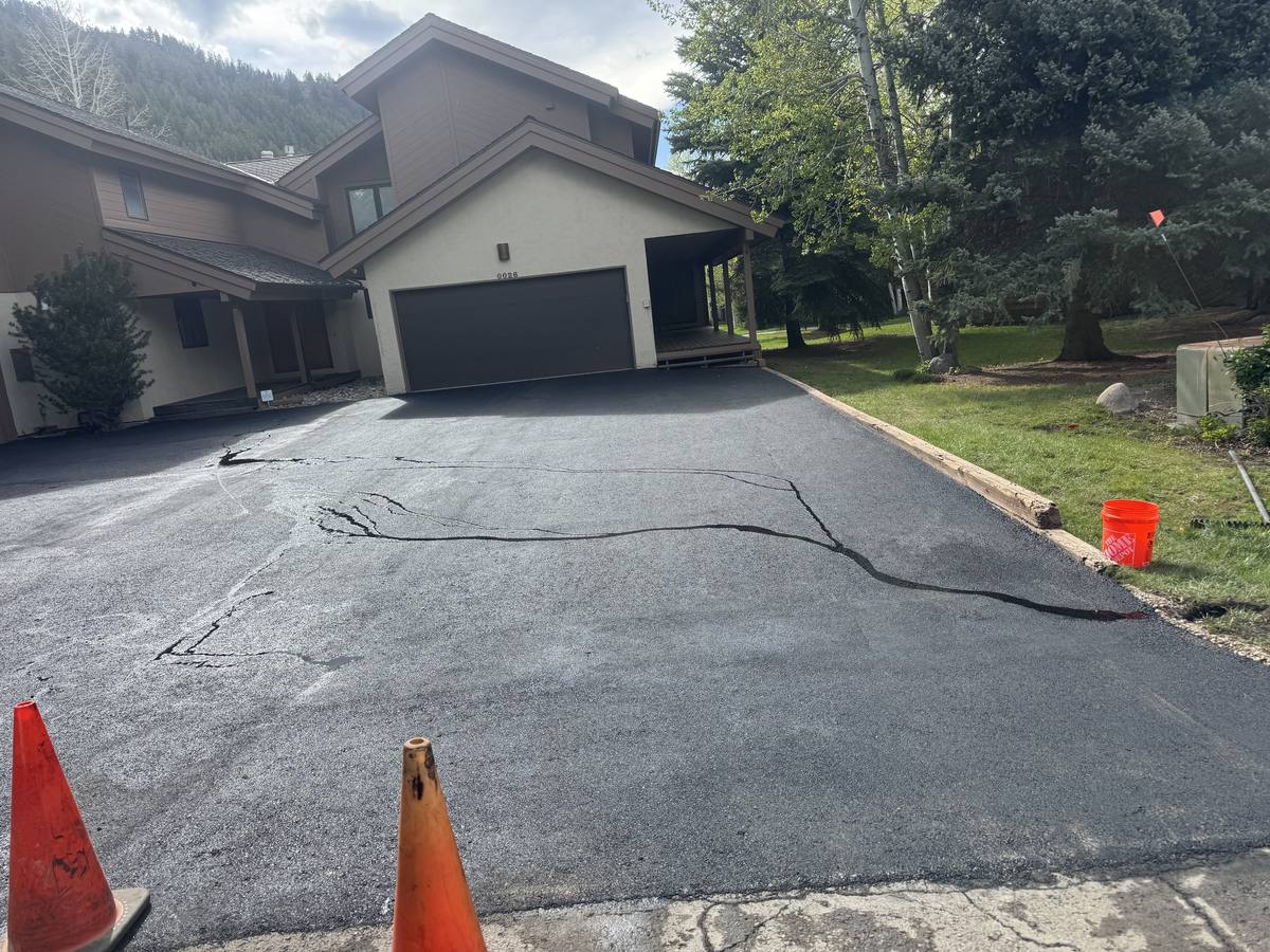 A shared driveway at attached homes, cones still out from the day's work