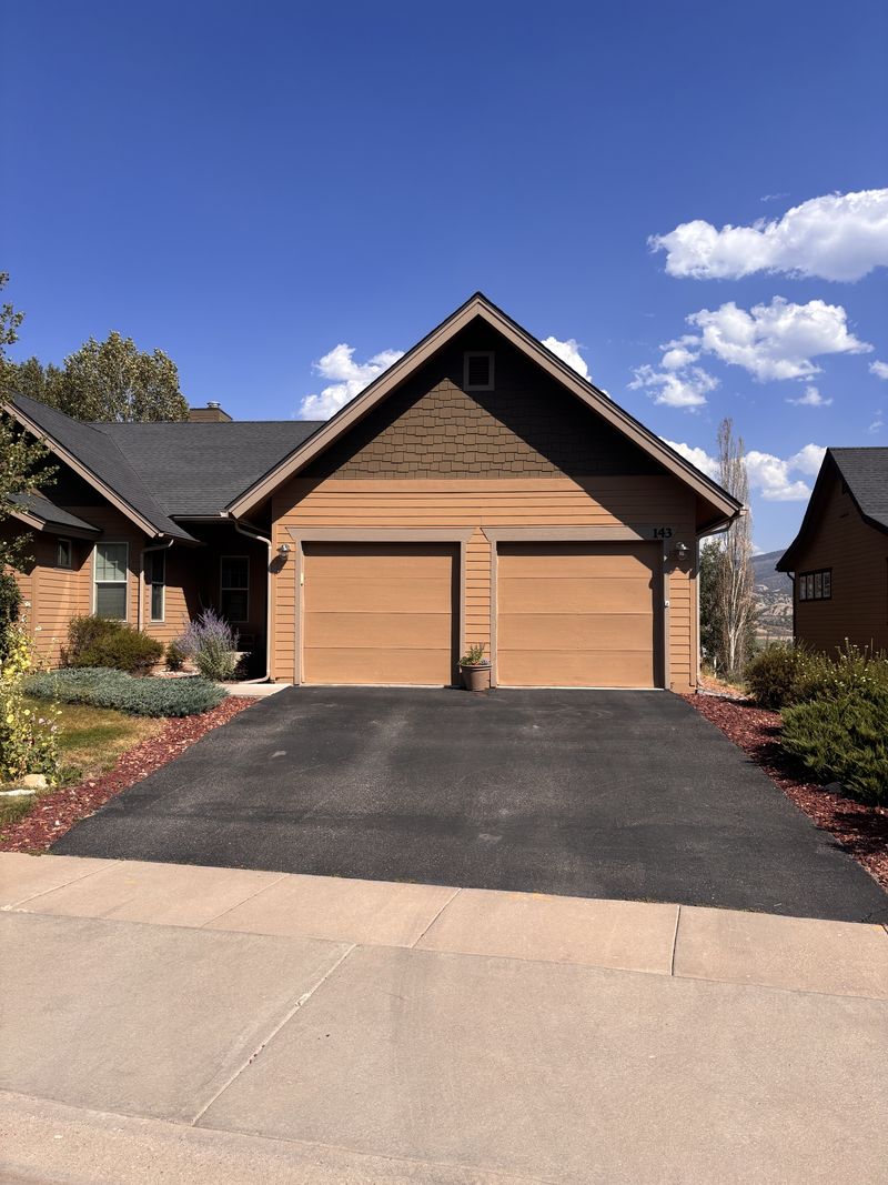 A resurfaced asphalt driveway at a home in the Eagle River Valley